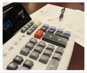 Calculator and tax papers on a desk